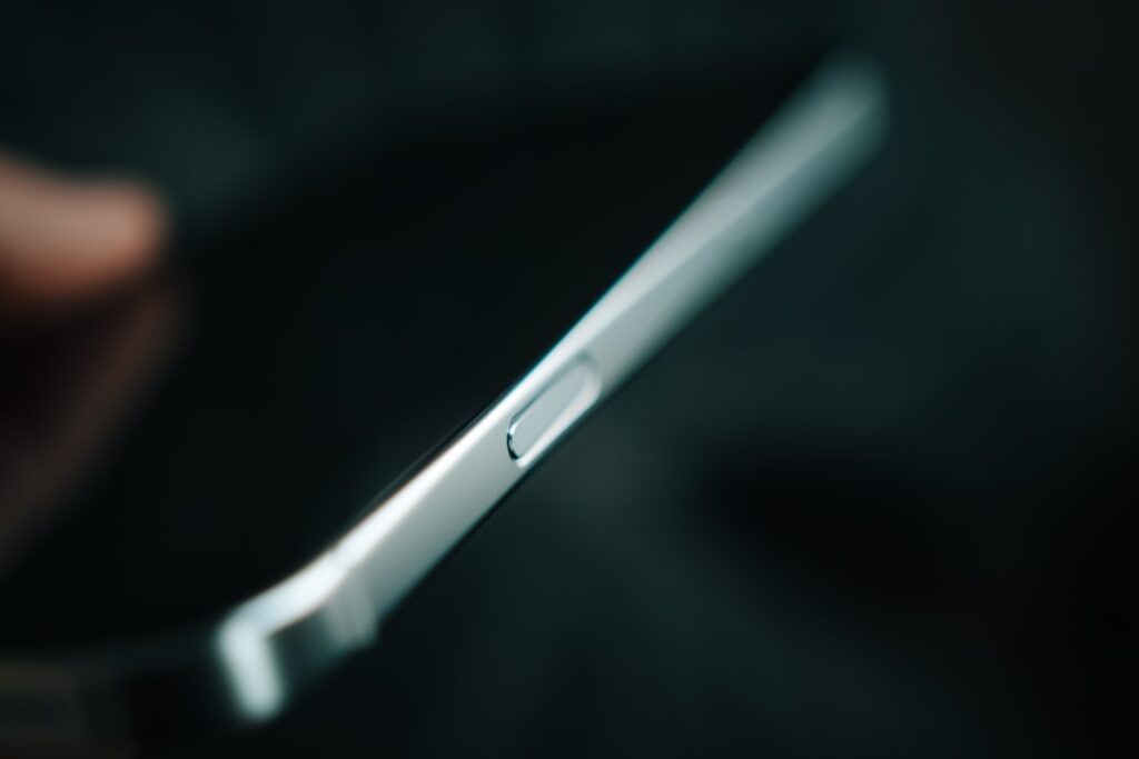 A close up of a person holding a cell phone