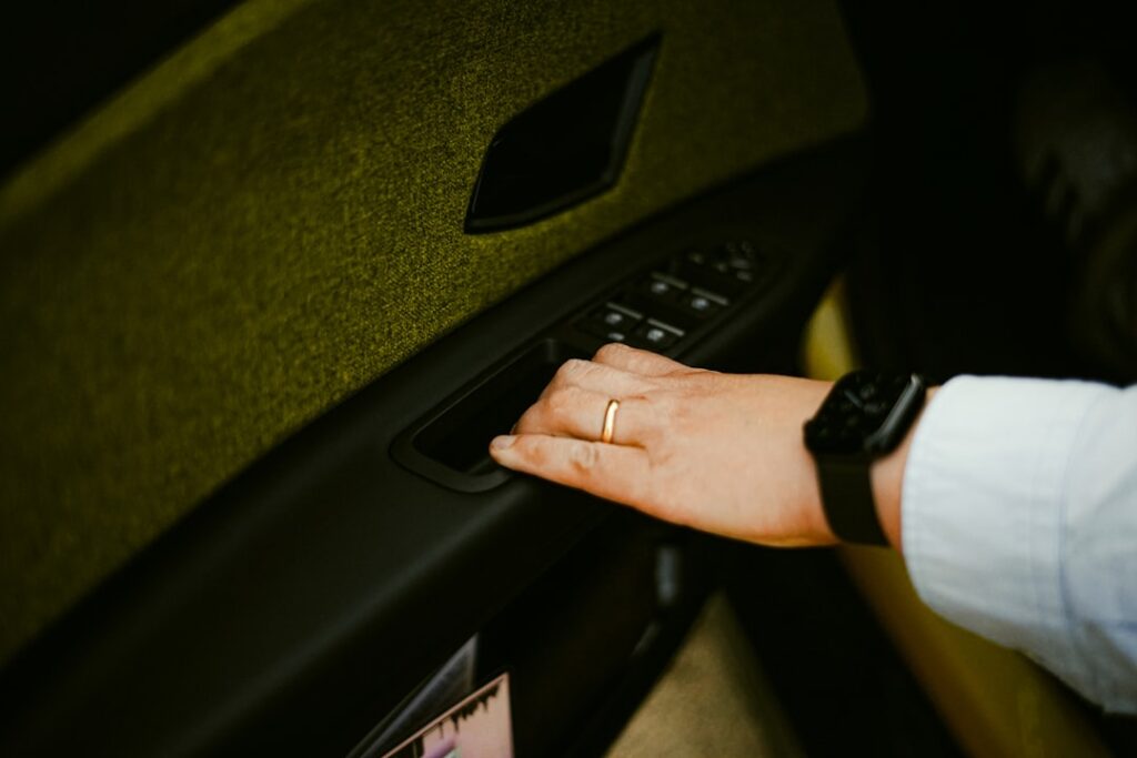 Hand opening car door with power window controls