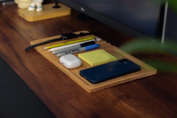 a wooden desk with a computer monitor and a keyboard