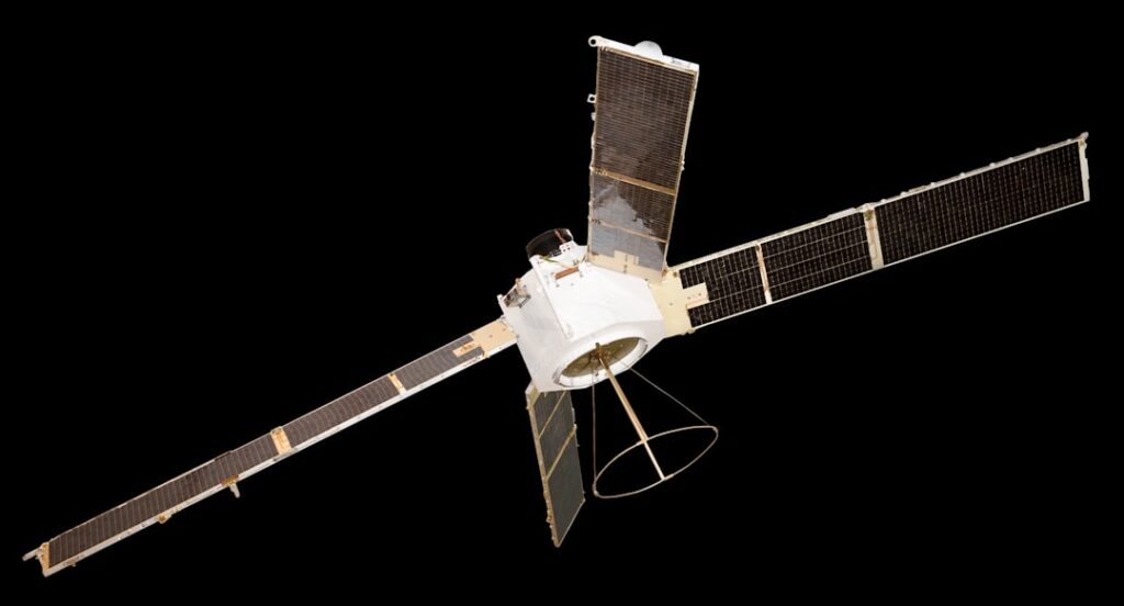 A satellite with solar panels against a black background