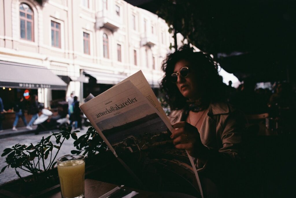 a person reading a newspaper