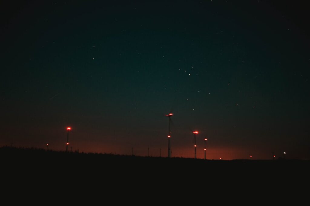 the night sky is lit up by street lights