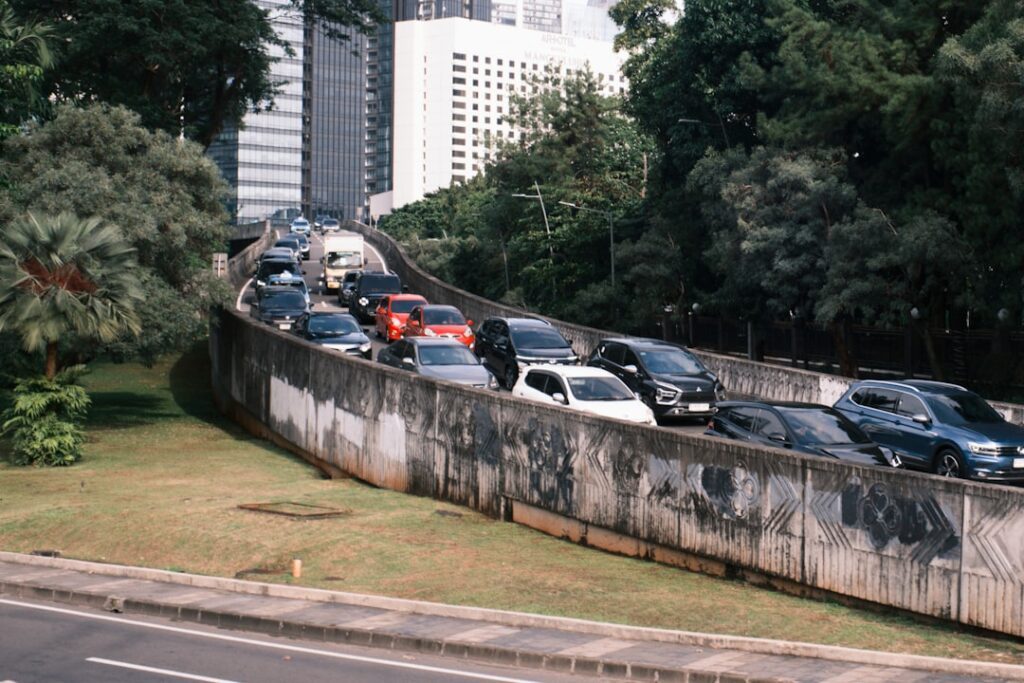 Cars stuck in traffic on a highway overpass.