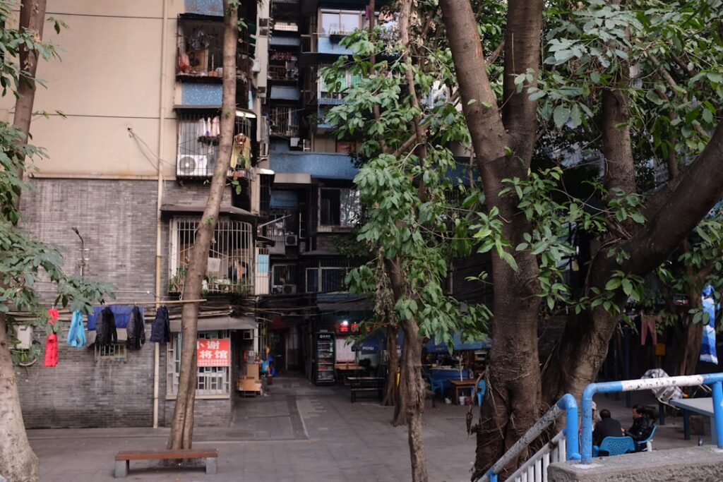 Apartment buildings with trees and laundry hanging