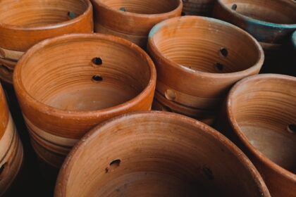 a pile of clay pots sitting next to each other