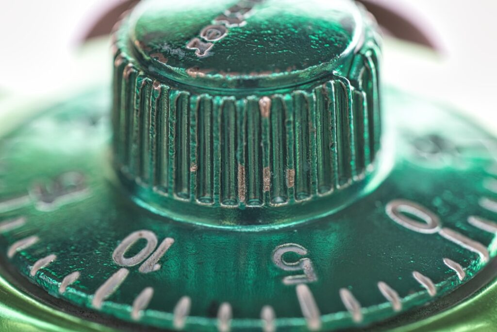 a close up of a green metal object
