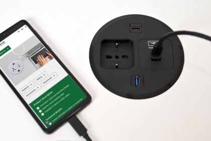 A smart phone plugged into a power strip