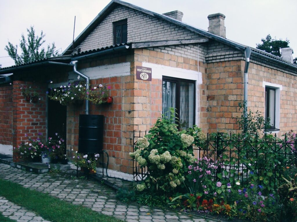 A small brick house with a garden and garden