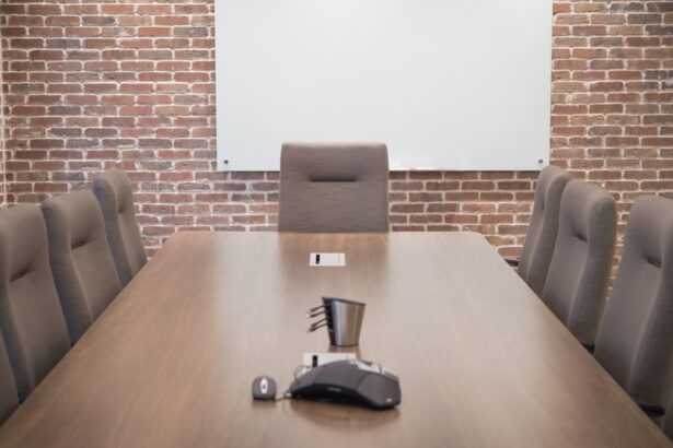 a conference room with a projector screen and chairs