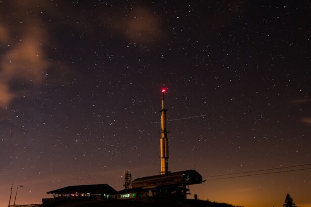 Tower and buildings under starry night sky