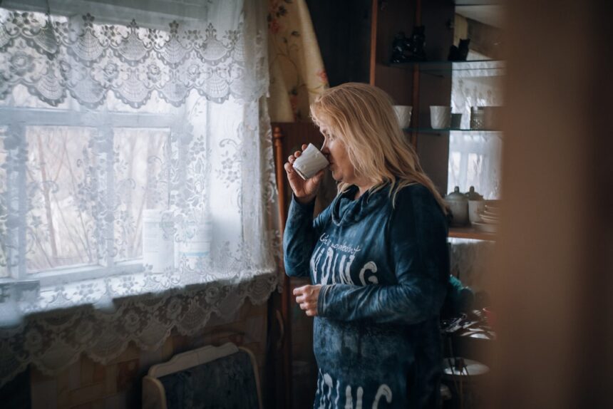 women drinking in a coffee cup in a room during daytime