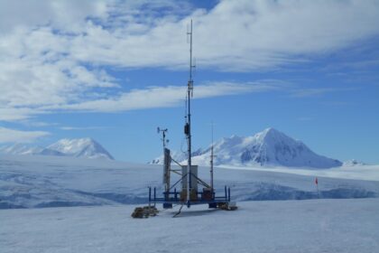 a very tall tower sitting on top of a snow covered slope