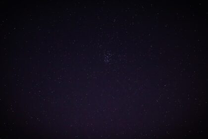 a night sky with a few stars in it