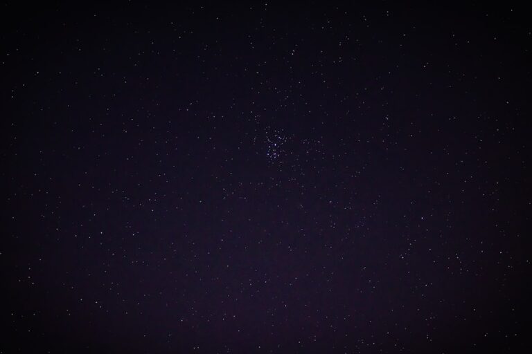 a night sky with a few stars in it