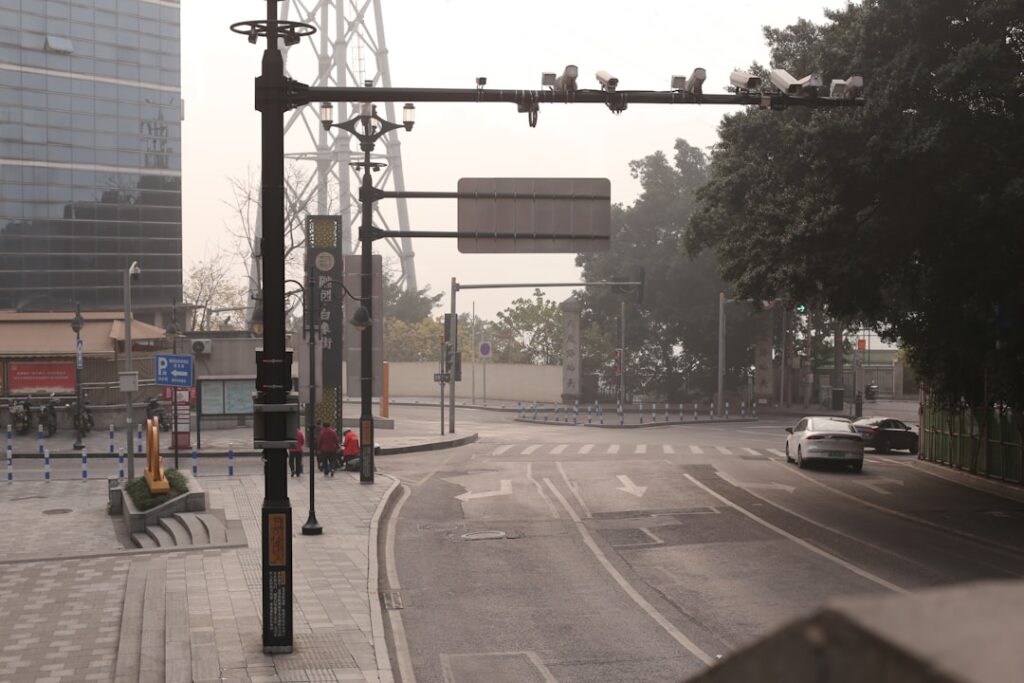 Urban street intersection with traffic lights and cars