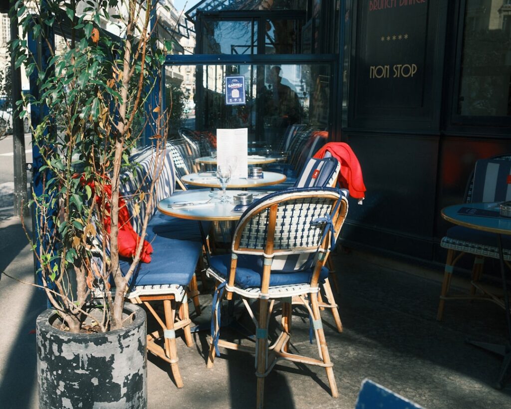Outdoor cafe tables and chairs on a sunny day