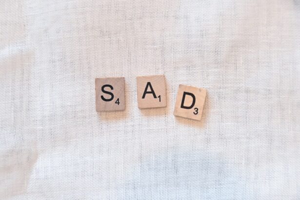 scrabble pieces spelling out sad