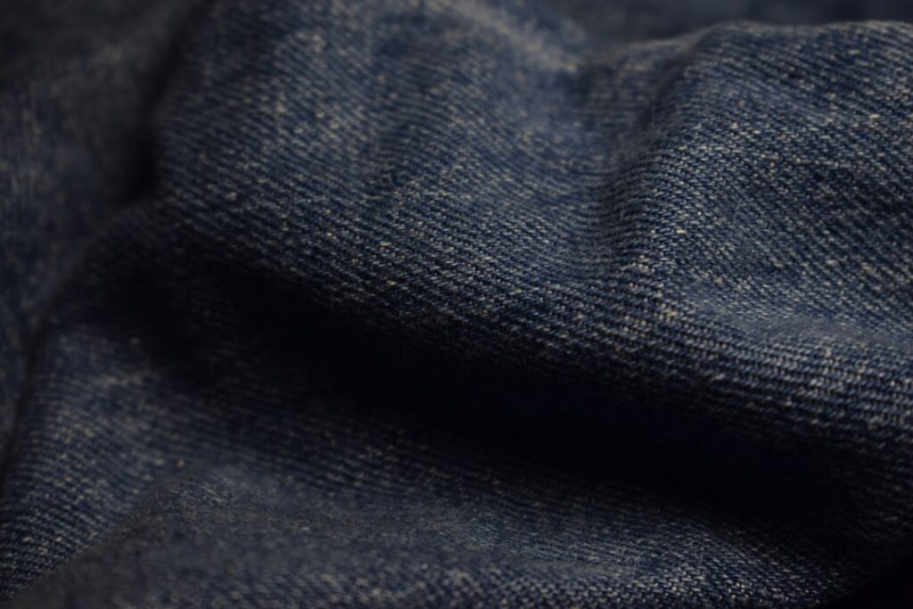 Close-up of dark blue denim fabric texture