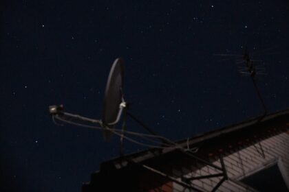 A satellite dish sitting on top of a roof