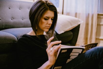 woman in black long sleeve shirt sitting on couch