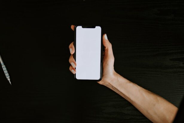 person holding white iphone 5 c
