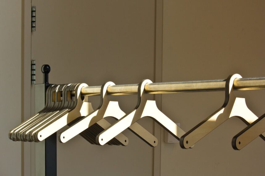 A row of wooden hangers is hanging.