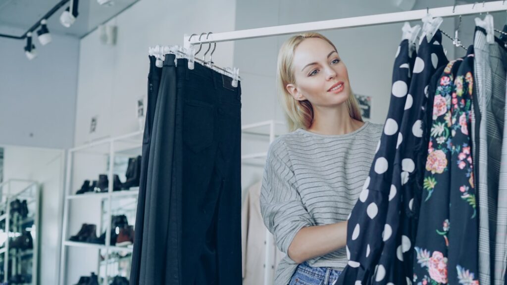 A woman shops for clothes in a boutique.