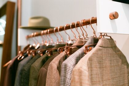 a rack of clothes hanging on a wall