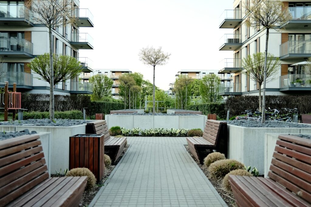 a courtyard with benches and trees
