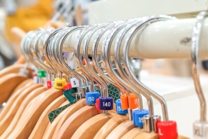 a row of wooden clothes hangers with numbers on them
