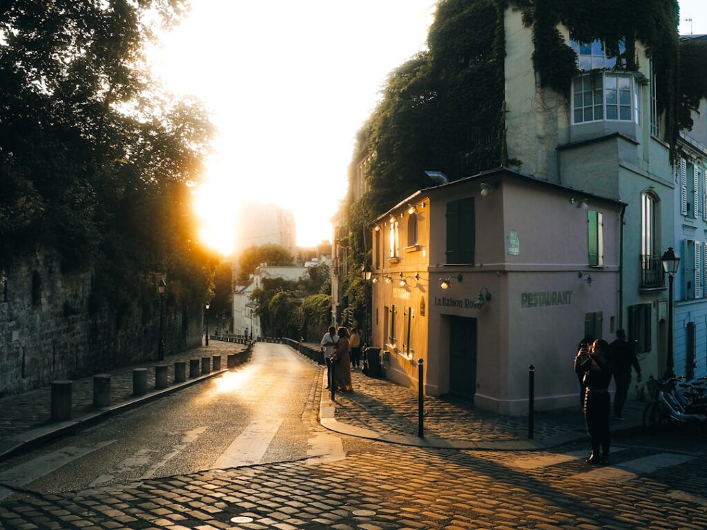 Cobblestone street with buildings at sunset