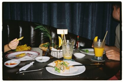 Table with leftover food and drinks after meal