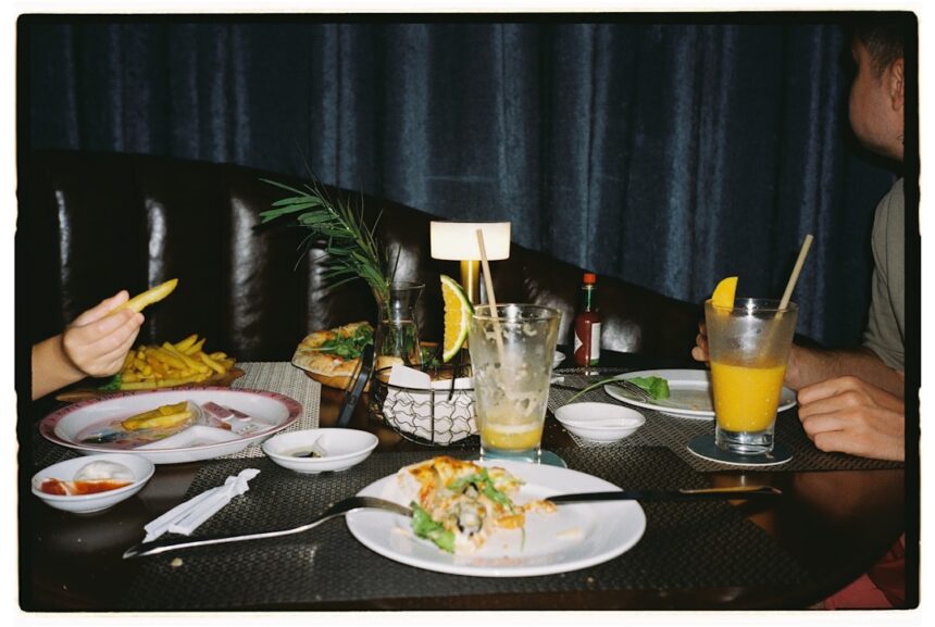 Table with leftover food and drinks after meal
