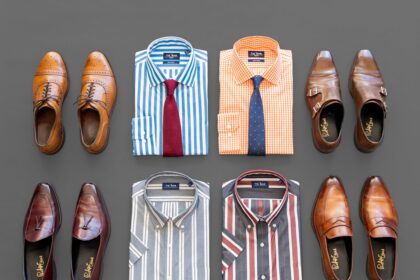 brown leather shoes beside red and white striped socks