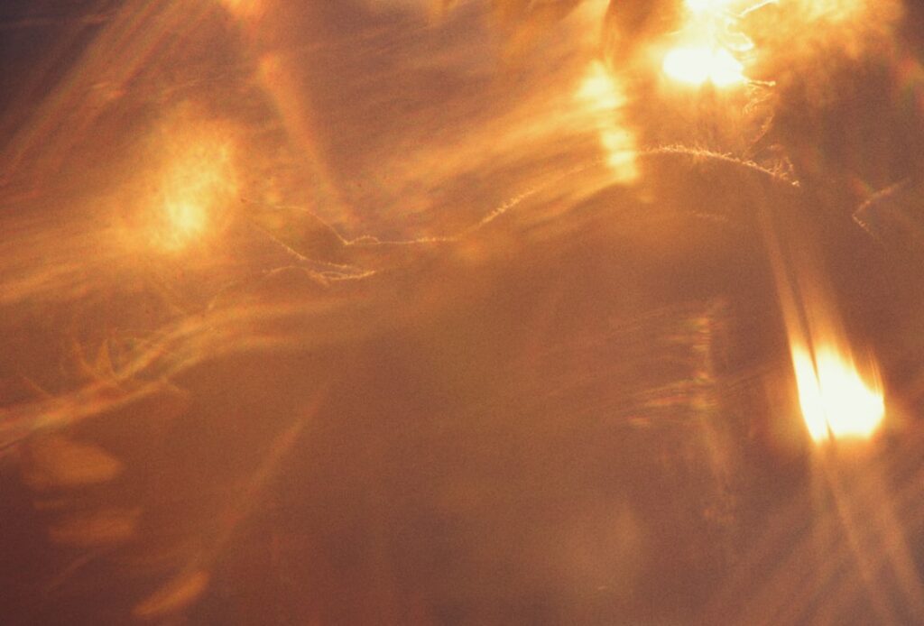 Abstract warm glowing light streaks and flares