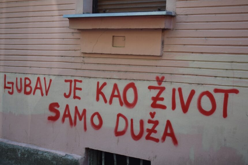 Red graffiti on a building wall
