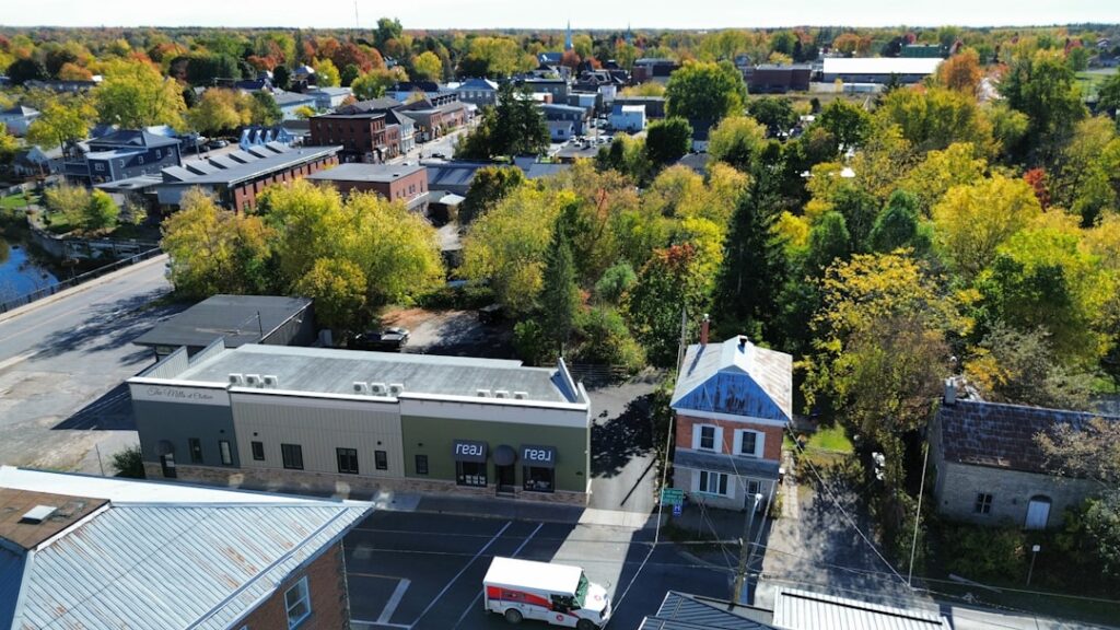 Aerial view of a small town with autumn foliage.