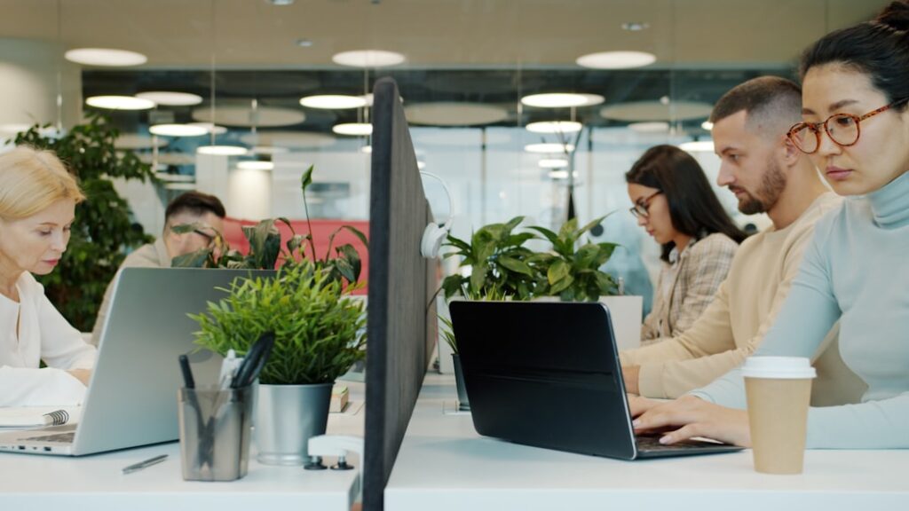 People working at desks in a modern office.