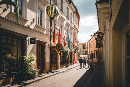 A city street with people walking down it
