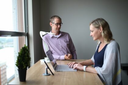 man and woman sitting at table