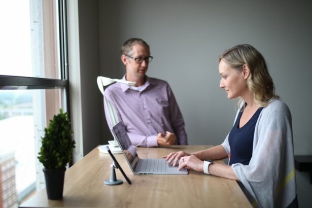 man and woman sitting at table