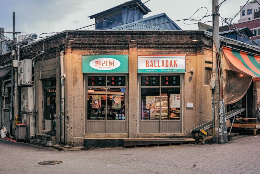 A street corner with a small store on the corner