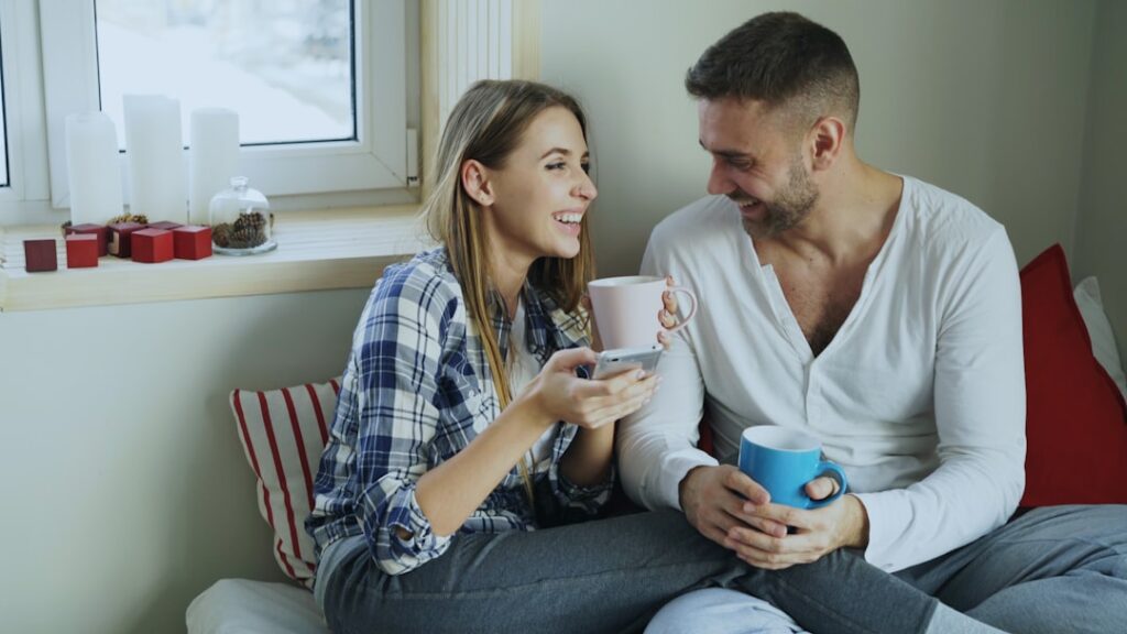Couple enjoying coffee together by the window