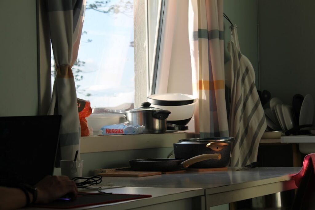 Kitchen counter with window and cooking supplies