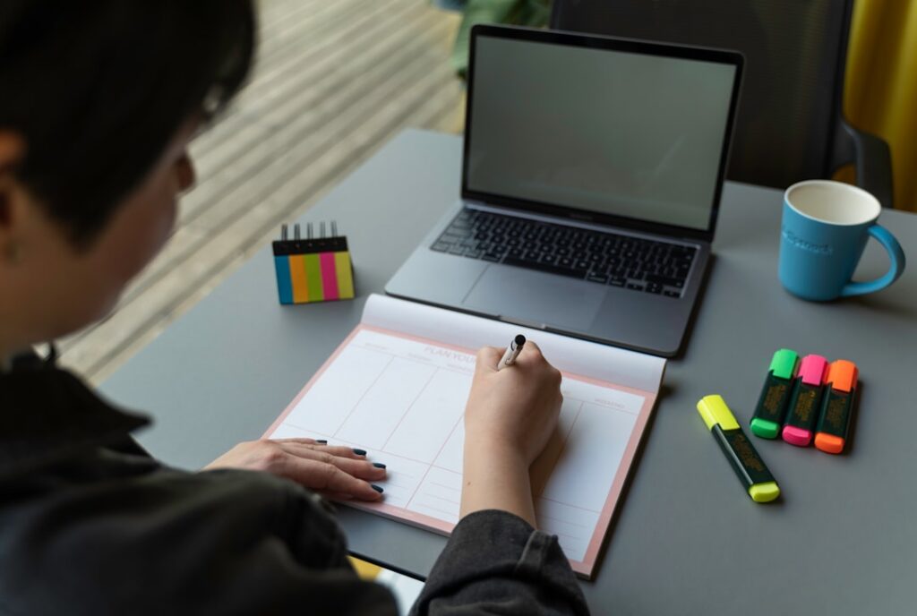 a man writing on a piece of paper