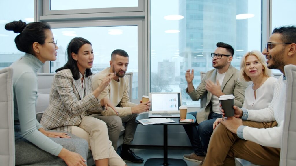 Diverse group of people in a modern office meeting.