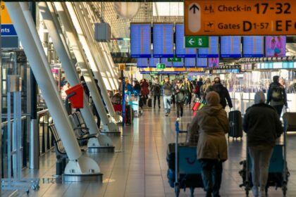 a group of people walking through an airport