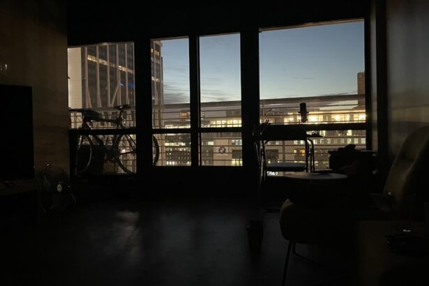 silhouette of people sitting on chair near window during daytime