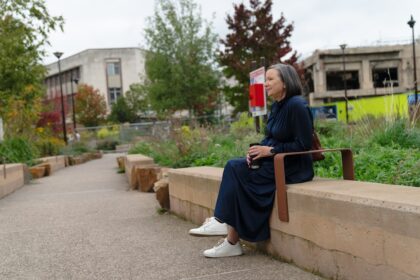 Woman sitting on a bench in a park