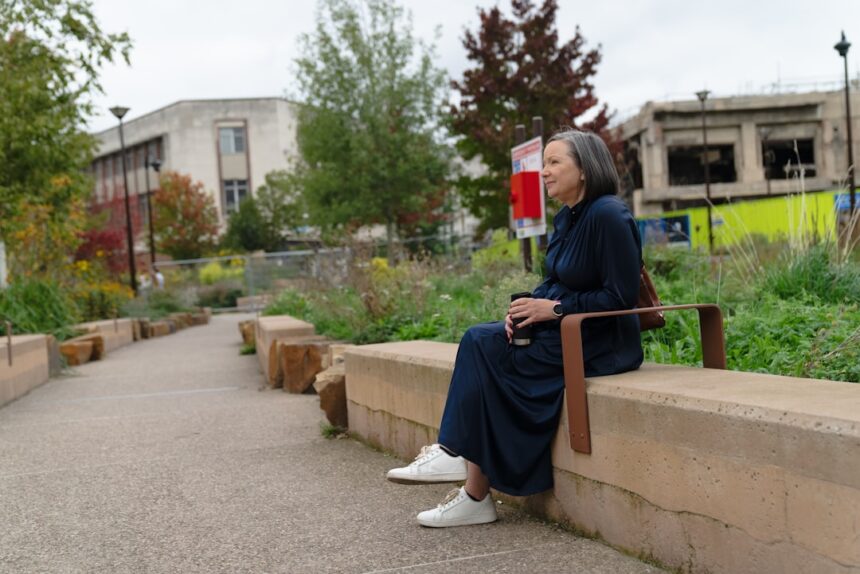 Woman sitting on a bench in a park